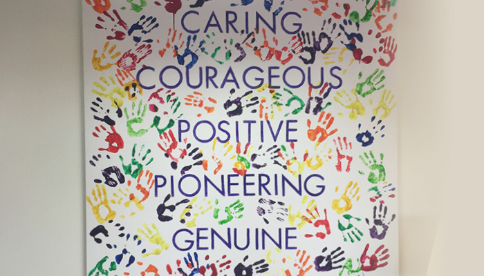 Picture of the hospice&#39;s values saying, Caring, Courageous, Positive, Pioneering, Genuine