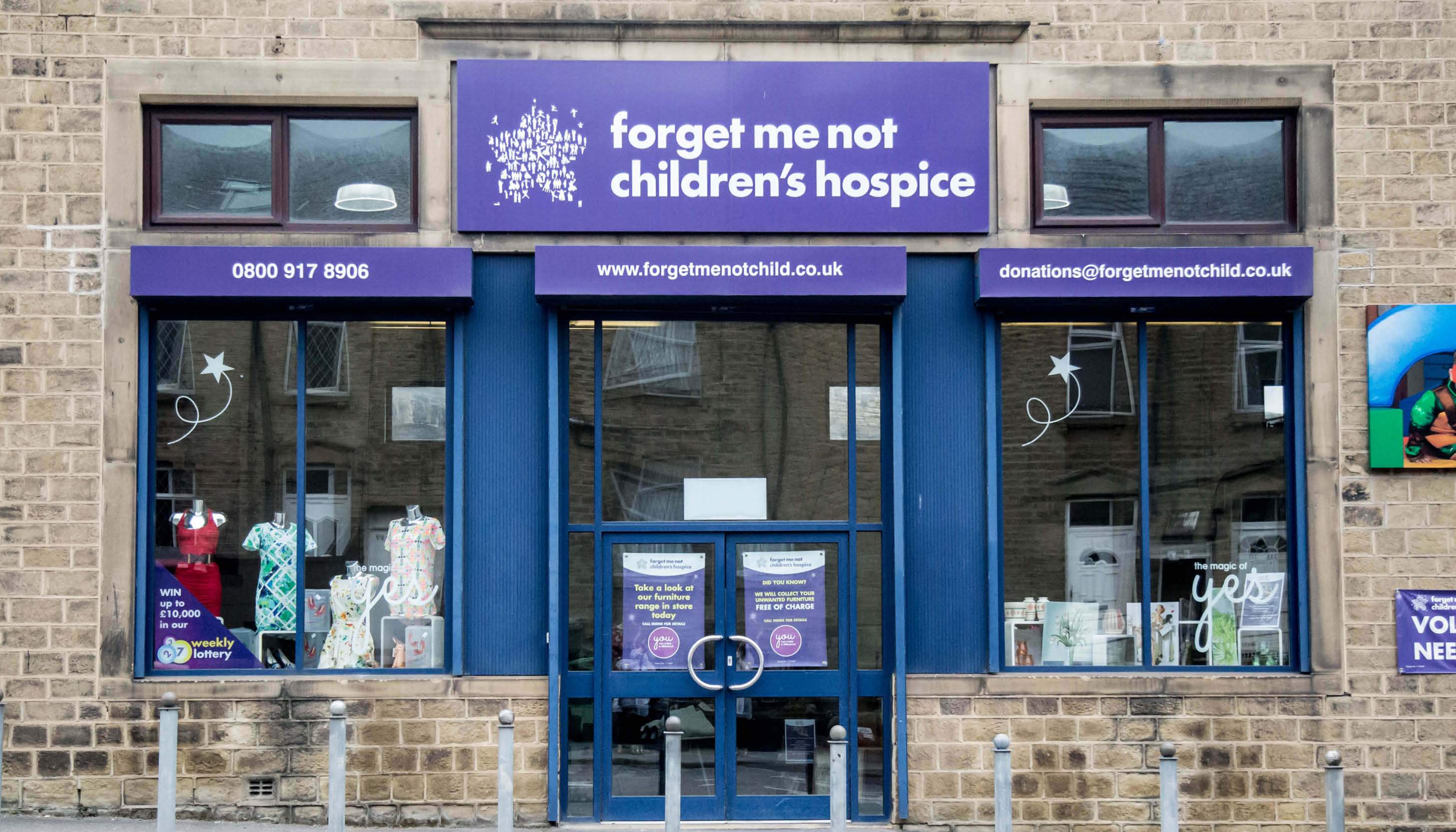 Picture of on our the Hospice&#39;s shop fronts in the new purple brand colour.