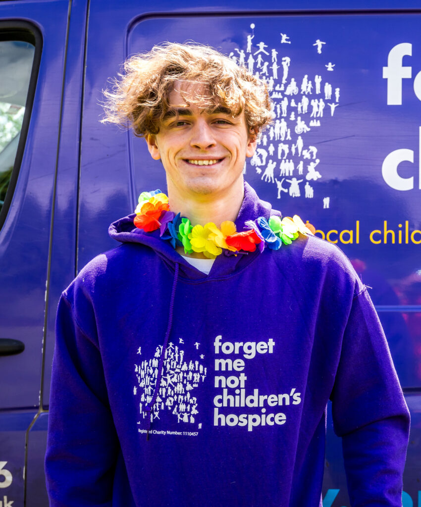 Rhys Connah wearing a purple forget me not hoodie
