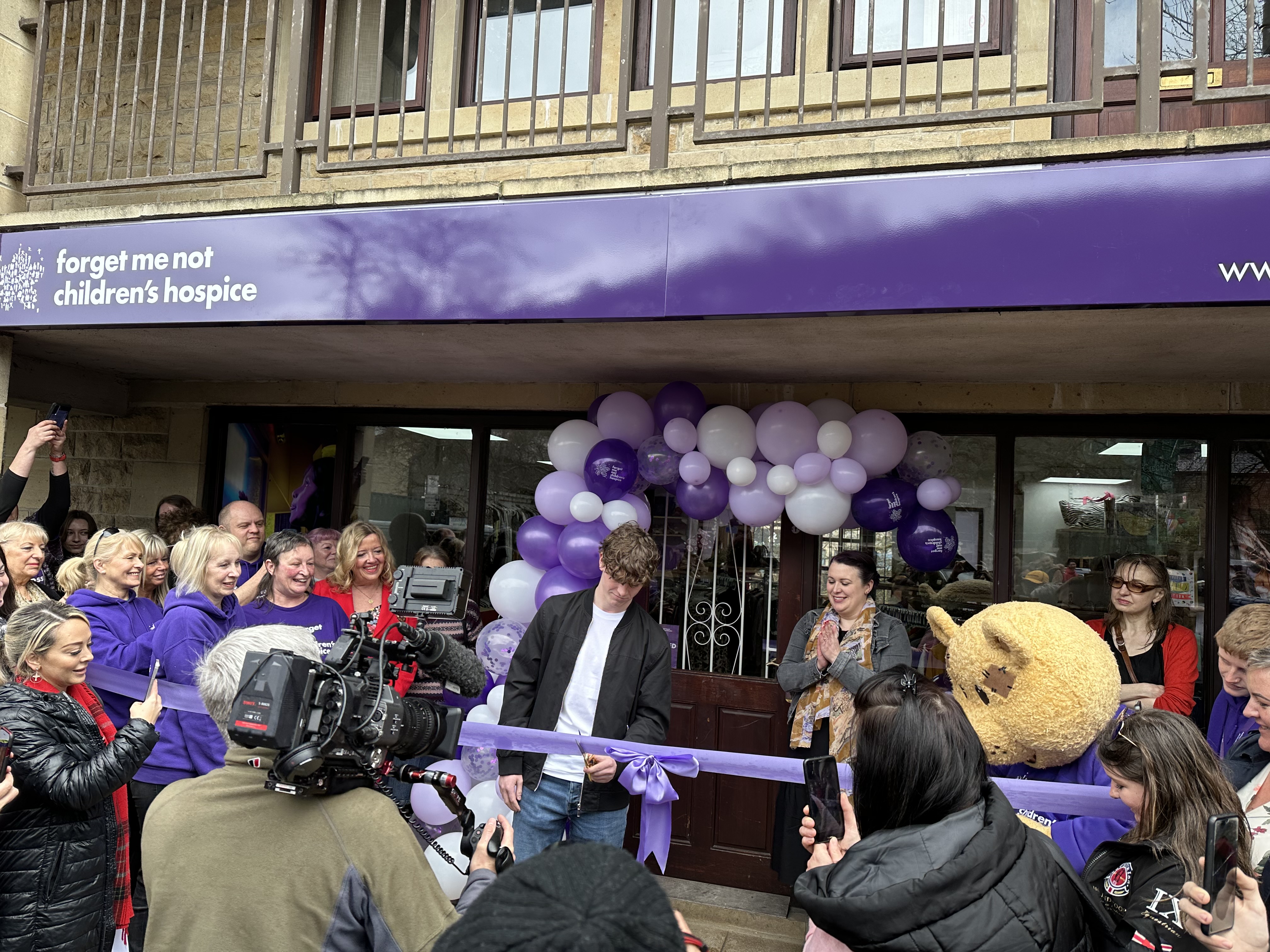 Rhys Connah cuts ribbon at Forget Me Not Children's Hospice shop opening