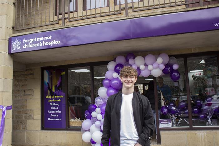 Rhys Connah outside Forget Me Not Children's Hospice charity shop